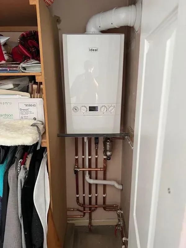 Gas boiler in a cupboard after its annual service